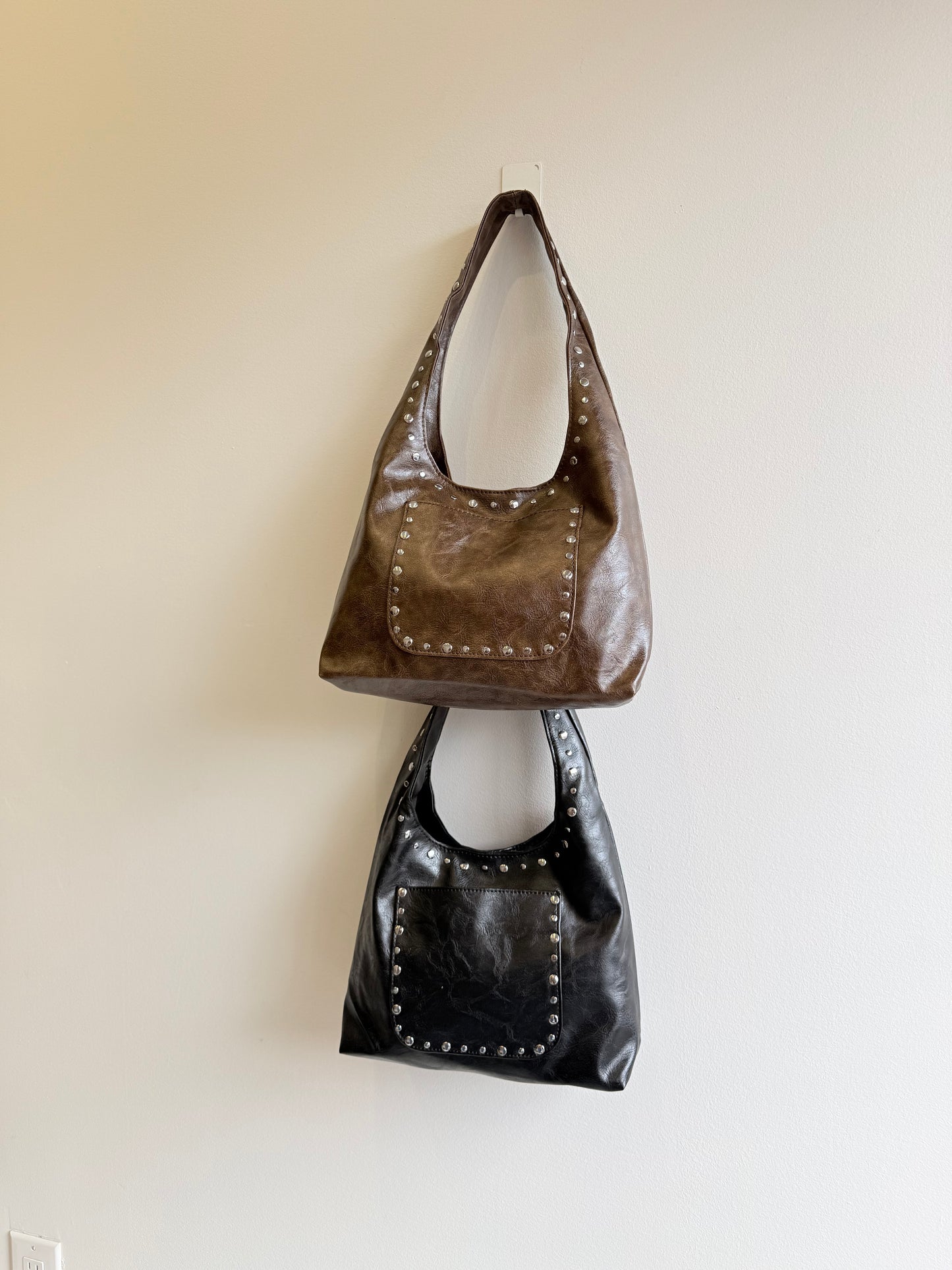MISHA Studded hobo bag