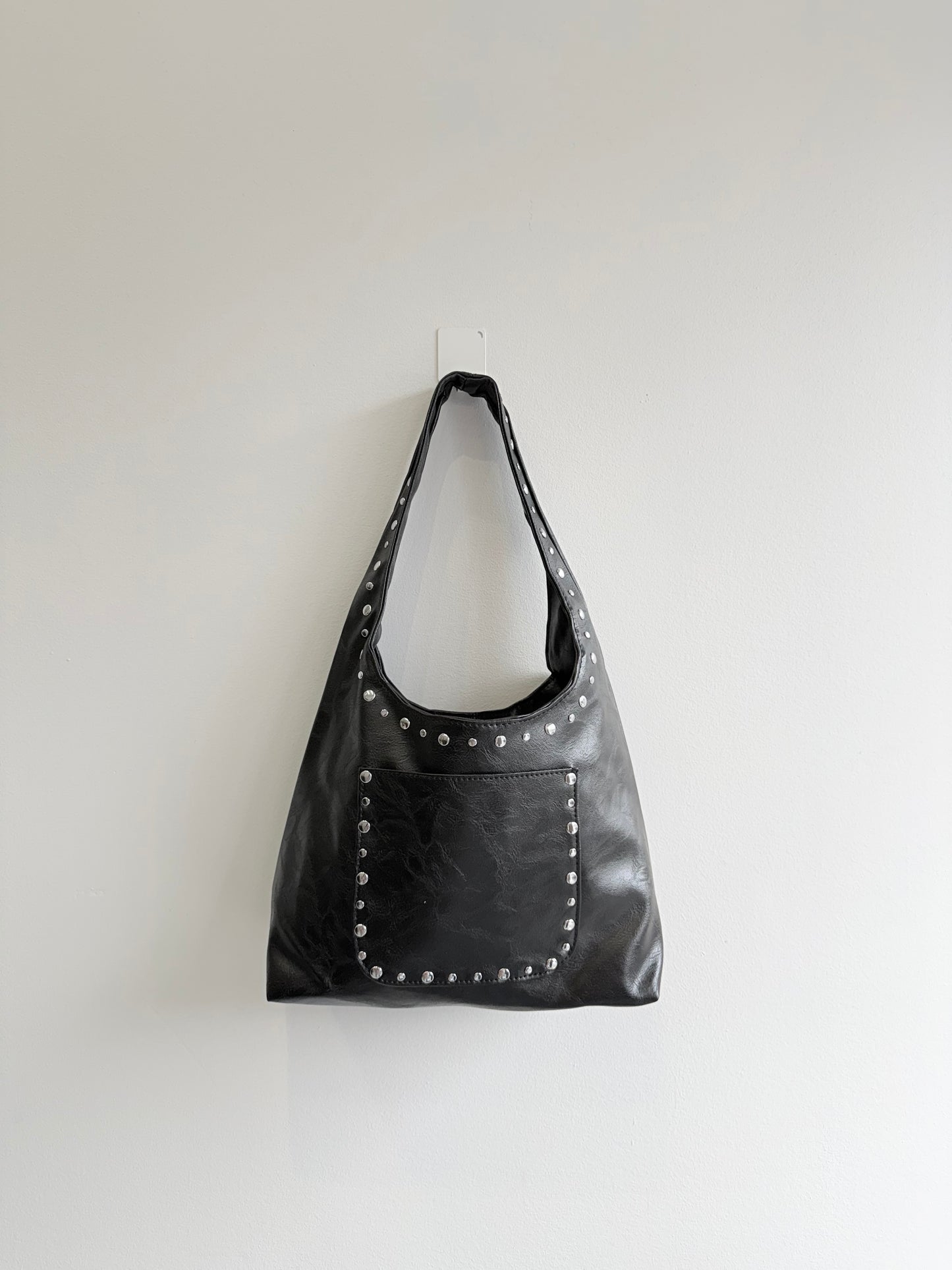 MISHA Studded hobo bag