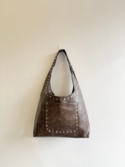 MISHA Studded hobo bag