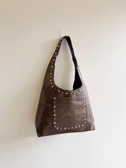 MISHA Studded hobo bag