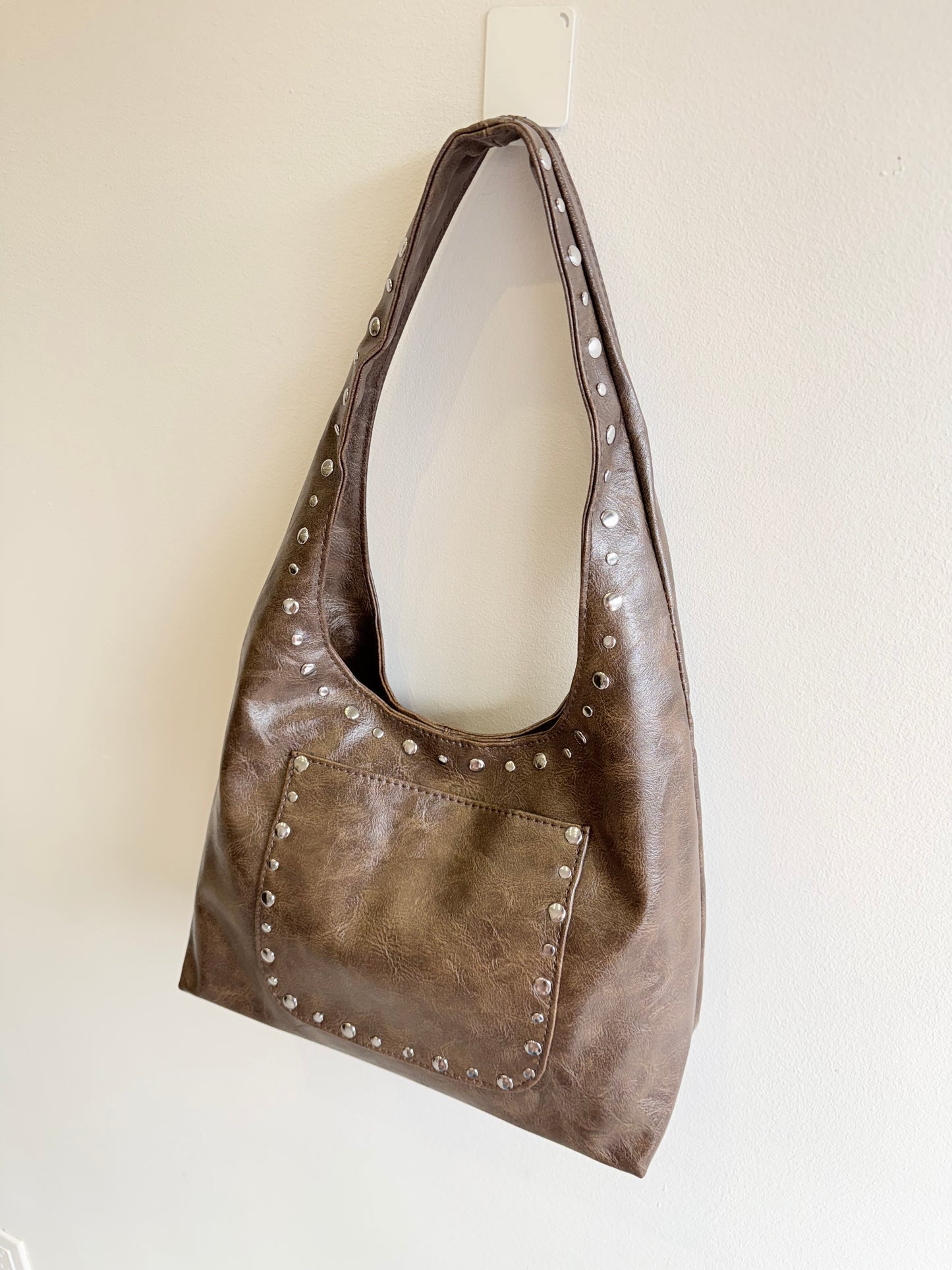 MISHA Studded hobo bag