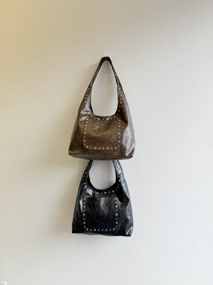 MISHA Studded hobo bag