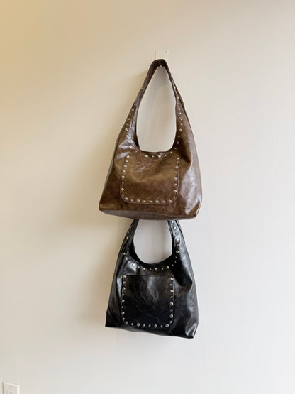 MISHA Studded hobo bag