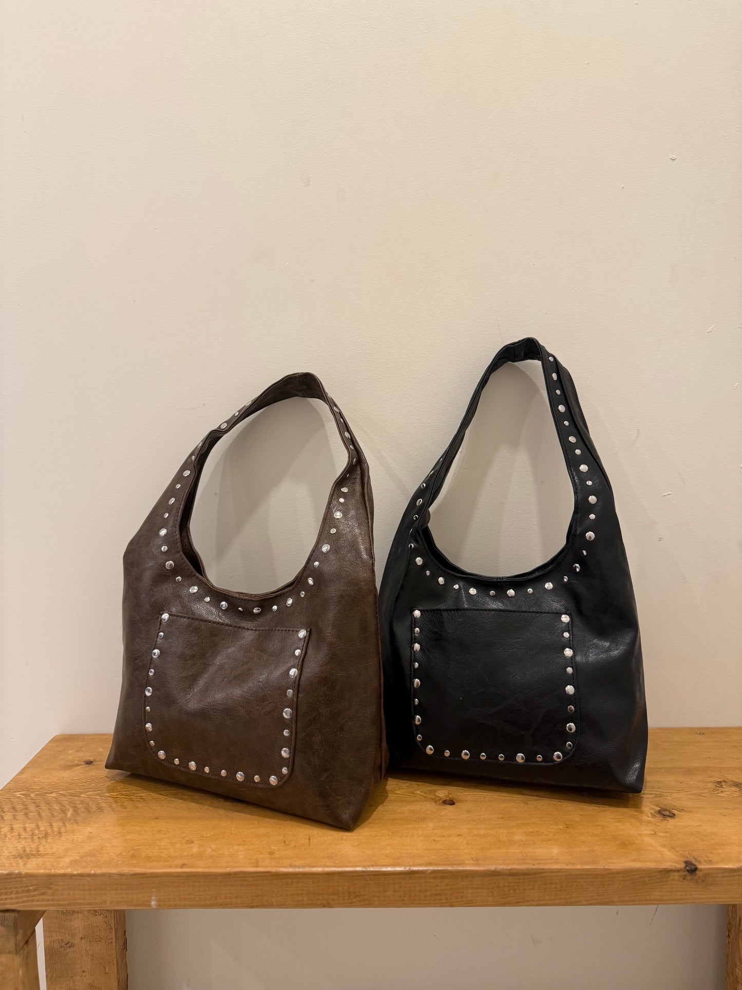 MISHA Studded hobo bag
