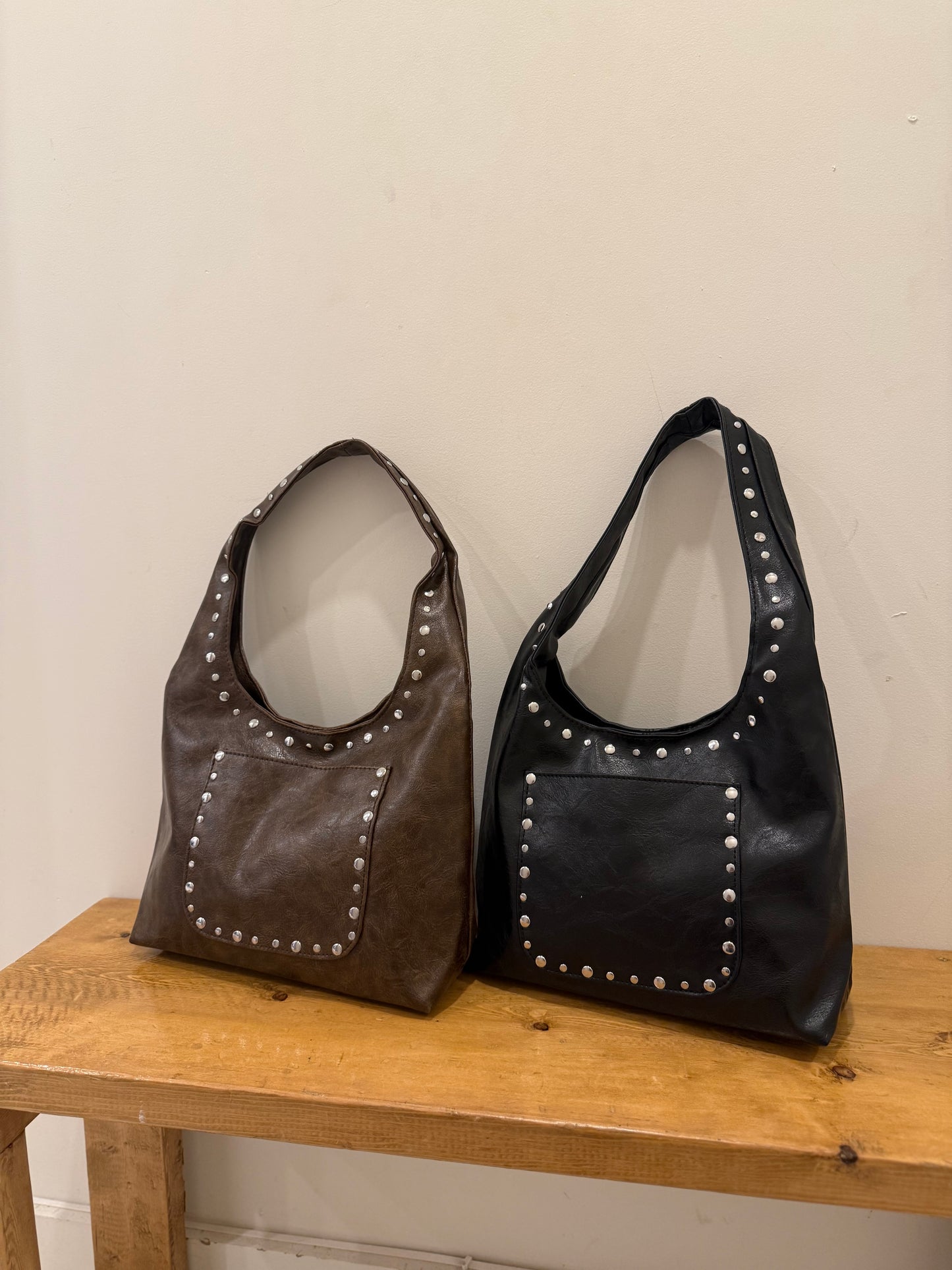 MISHA Studded hobo bag